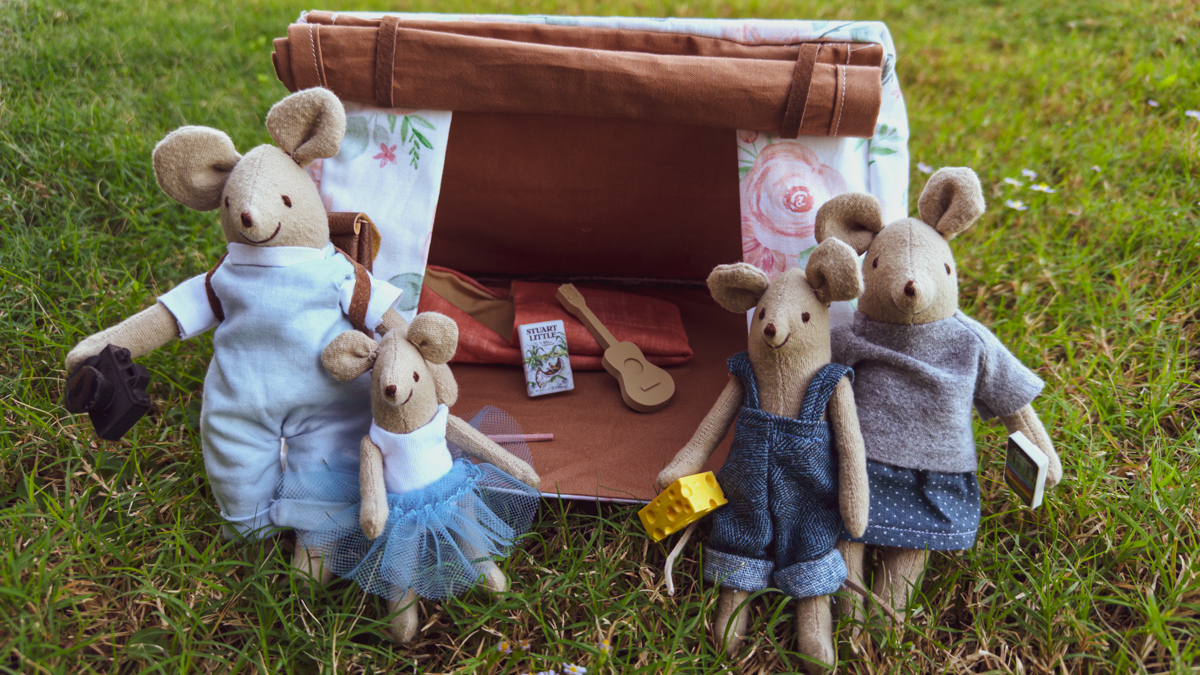 Handcrafted mice collection in a whimsical setting.